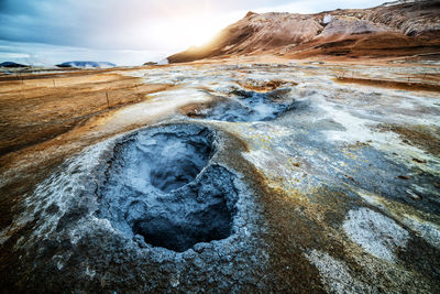 Scenic view of volcanic landscape against sky