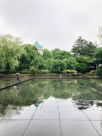 Scenic view of lake against sky during rainy season