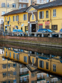 Reflection of buildings in puddle