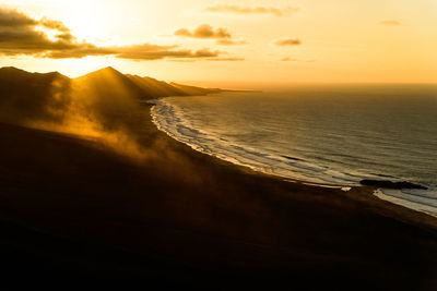 Scenic view of sea against sky during sunset at playa de cofete 