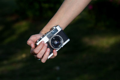 Close-up of hand holding camera