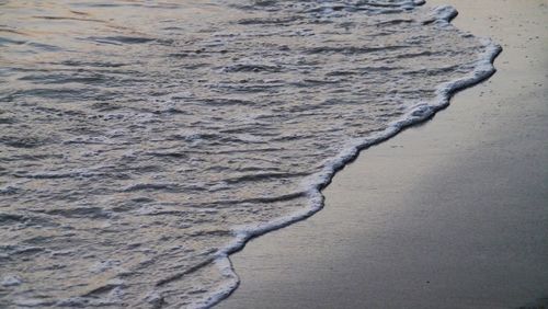 High angle view of surf on beach