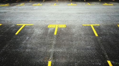 Yellow arrow symbol on road