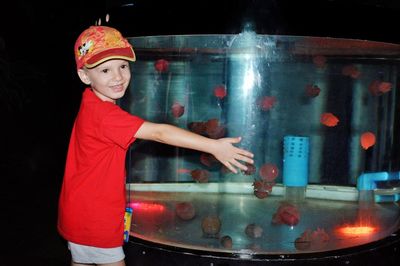 Portrait of smiling boy standing in water