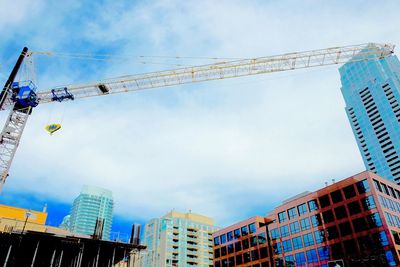 Low angle view of building against cloudy sky