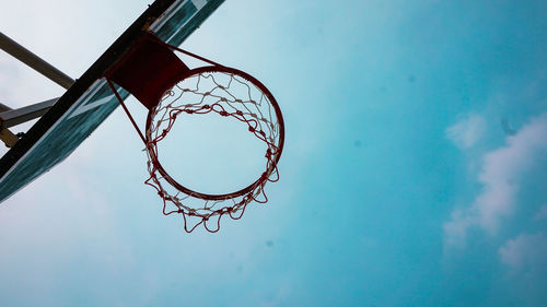 Low angle view of basketball hoop against sky