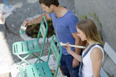 Young couple painting, stockholm, sweden