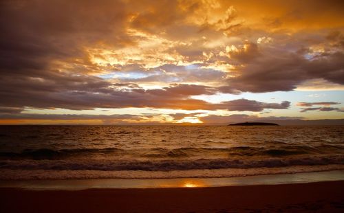 Scenic view of sea against cloudy sky