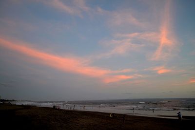 Scenic view of beach at sunset