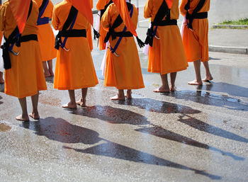 Low section of men wearing traditional clothing during festival