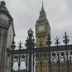 Low angle view of clock tower against sky