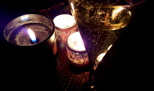 Close-up of illuminated lighting equipment on table