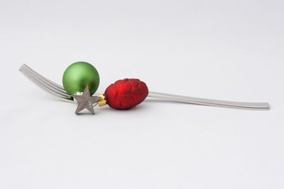 Close-up of tomatoes against white background