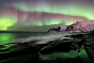 Scenic view of sea against sky at night