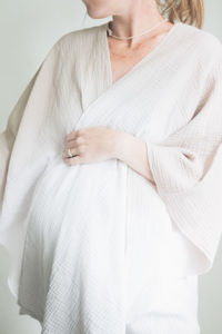 Pregnant woman in a neutral robe