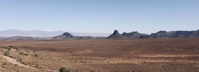 Scenic view of desert against clear sky