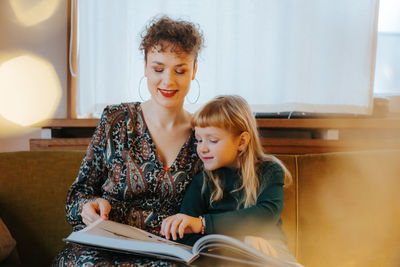 Mother and daughter reading a book