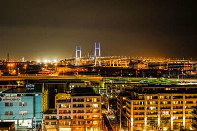 Illuminated buildings in city at night