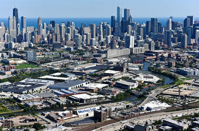 High angle view of buildings in city against sky