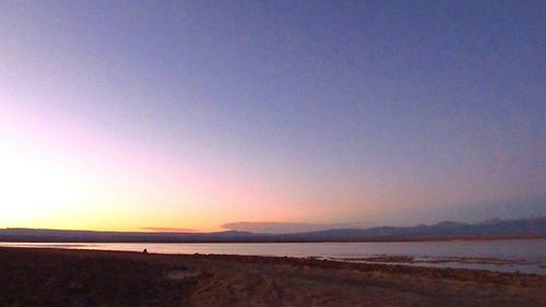 View of beach at sunset