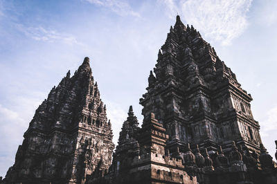 Low angle view of temple against cloudy sky