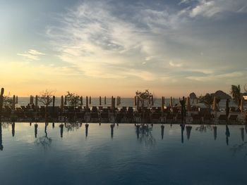 Silhouette of infinity swimming pool during sunrise