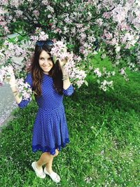 Portrait of young woman in grass