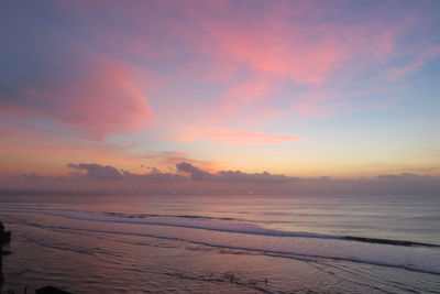 Scenic view of beach against sky during sunset in bali