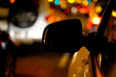 Close-up of illuminated car on city at night