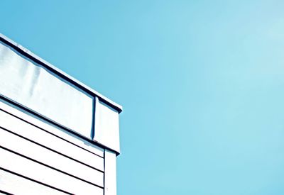 Low angle view of building against clear blue sky