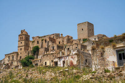Low angle view of old ruins against clear sky