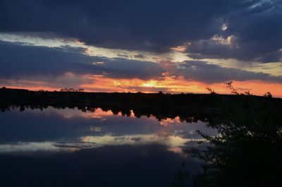 Scenic view of lake against sky during sunset