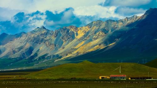 Scenic view of snowcapped mountains against sky