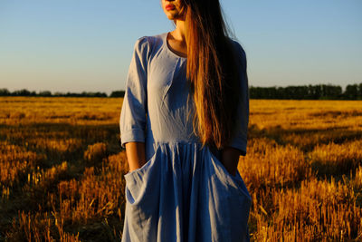 Escapism, getting away from it all, mental health, stress resilience. alone young woman in linen