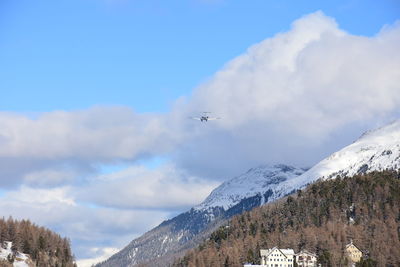 Scenic view of snow covered mountains against sky