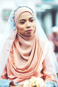 Woman wearing hijab while looking away