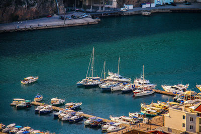 High angle view of boats moored at harbor