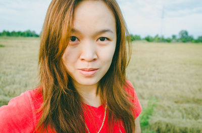 Portrait of woman on field