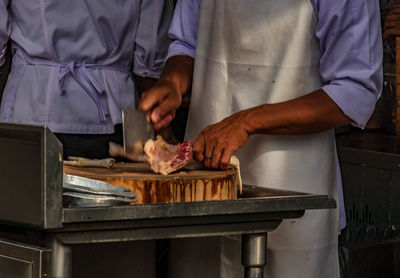 Man preparing food on cutting board