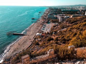 High angle view of buildings by sea