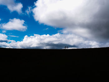 Scenic view of silhouette land against sky