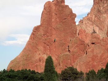 Low angle view of rock formation against sky