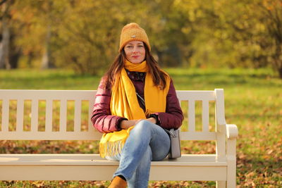 Portrait of teenage girl sitting on bench