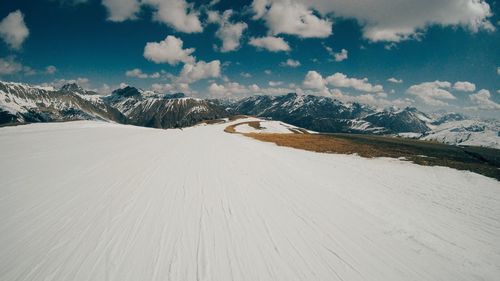 Scenic view of landscape against sky during winter