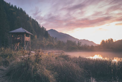 Scenic view of lake against sky during sunset