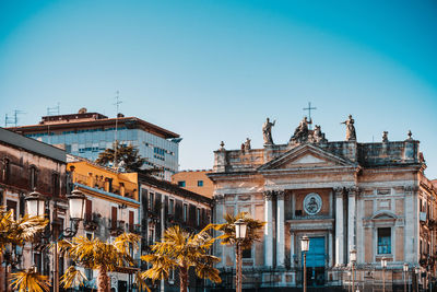 Facade of historic building against clear blue sky