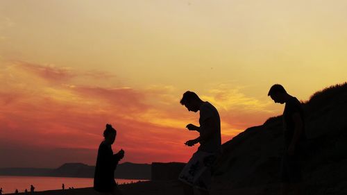 Silhouette of trees against sky at sunset