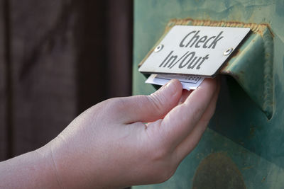 Close-up of hand holding paper