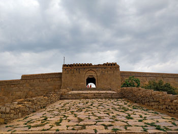 View of historical building against cloudy sky