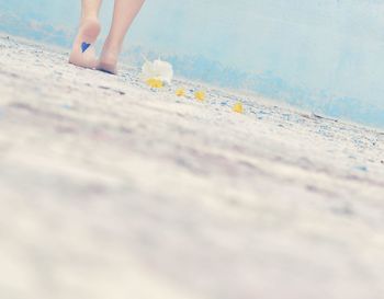 Low section of woman on tiled floor